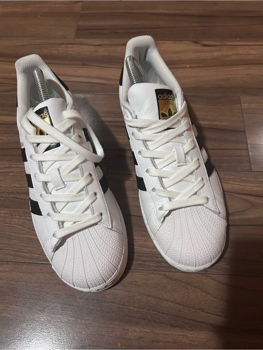 adidas White Sneakers with Black Stripes and Gold Tongue Logo